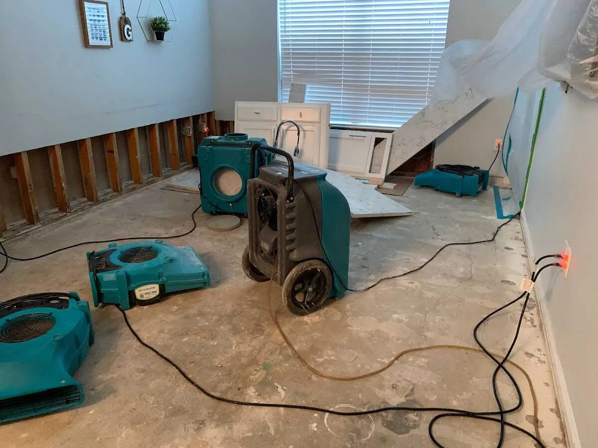 Dehumidifier in flood-cut room for Water Damage Restoration in Genesee